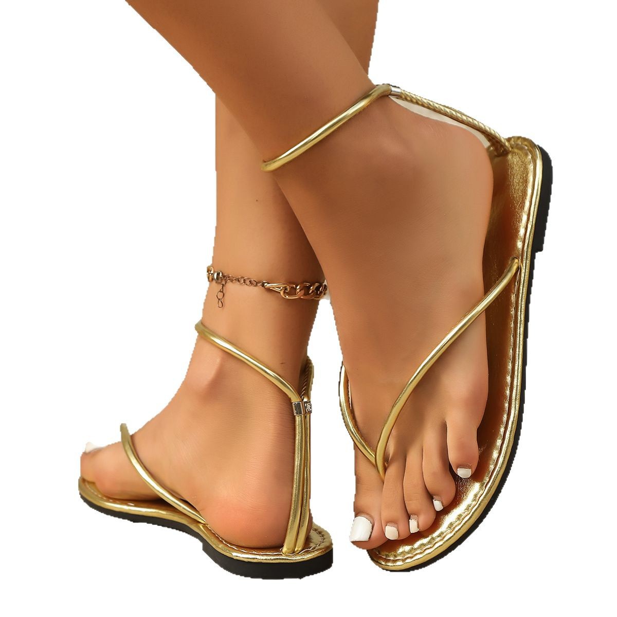 In the summer of 2025, women's outerwear sandals for export are a new style of European and American golden thin-band women's flat flip-toe herded sandals Item Picture