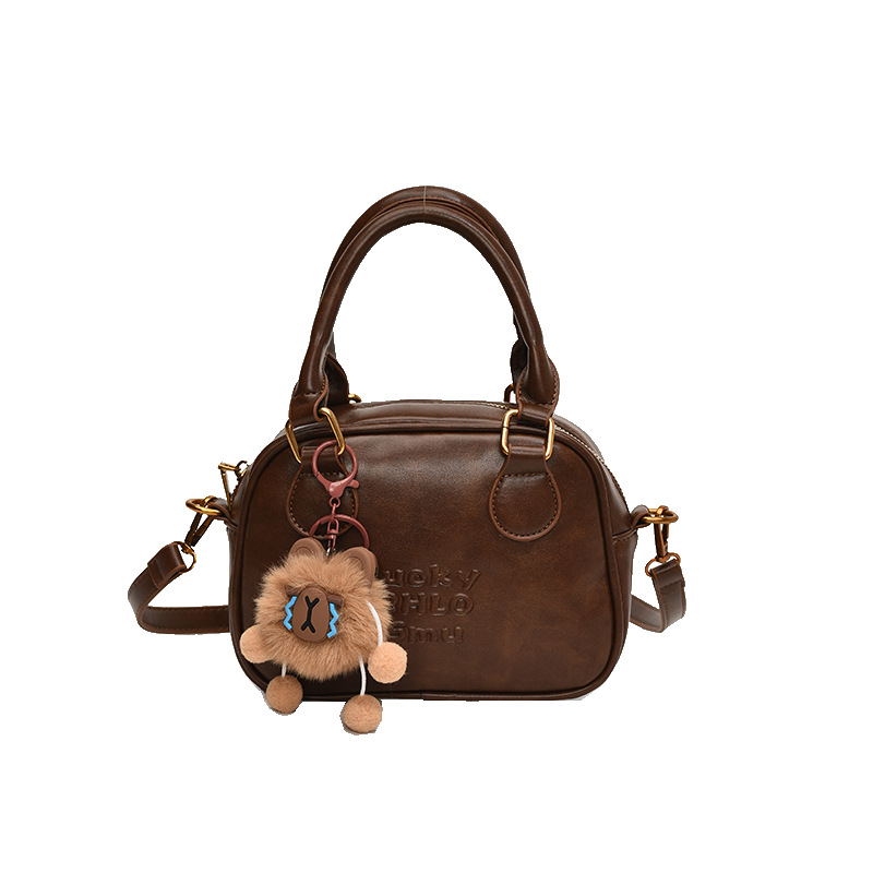 A niche retro bowling bag for women, a new spring/Summer 2025 single-shoulder crossbody bag, a high-end quality coffee-colored handbag Item Picture