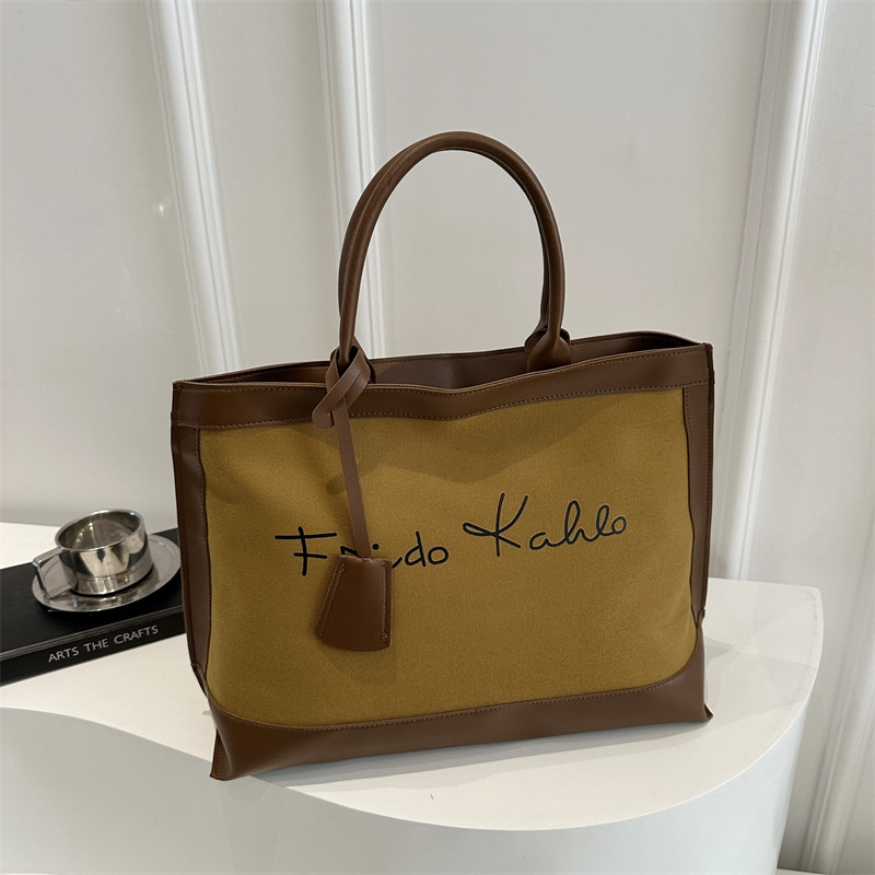 European and American large-capacity fashionable printed letter 2025 Spring new retro artistic and individualistic single-shoulder tote handbag for women Application Scenario