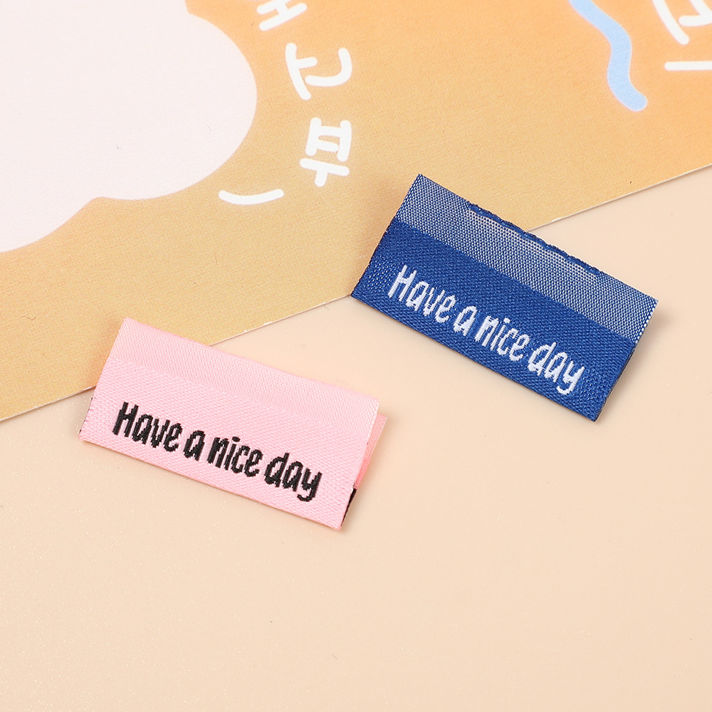  雅那斯 厂家现货批发新款箱包服饰彩色织唛领标洗水标唛刺绣尺码布标商标