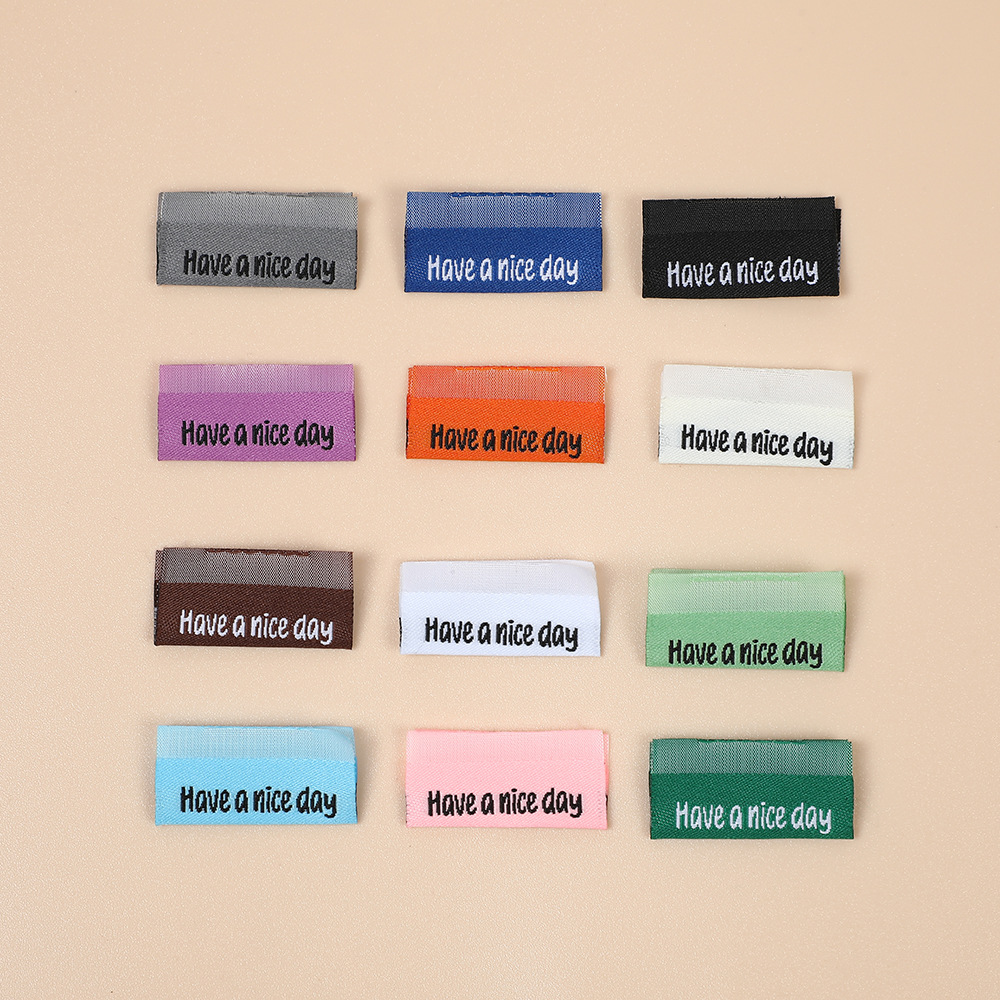  雅那斯 厂家现货 批发新款箱包服饰彩色织唛领标洗水标唛刺绣尺码布标商标