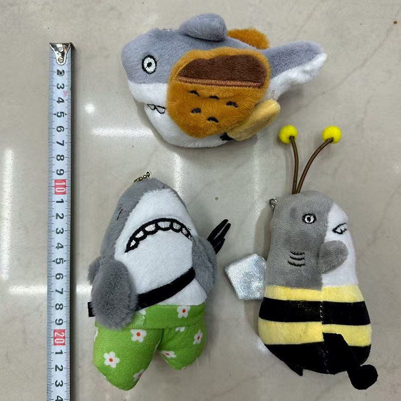 Shark carvings, shark honey, shark forks, parodies, plush toys, creative dolls, cartoon accessories, plush figurines, keychains, cloth dolls, cute decorations, gifts, claw machine factory direct sales Specification image