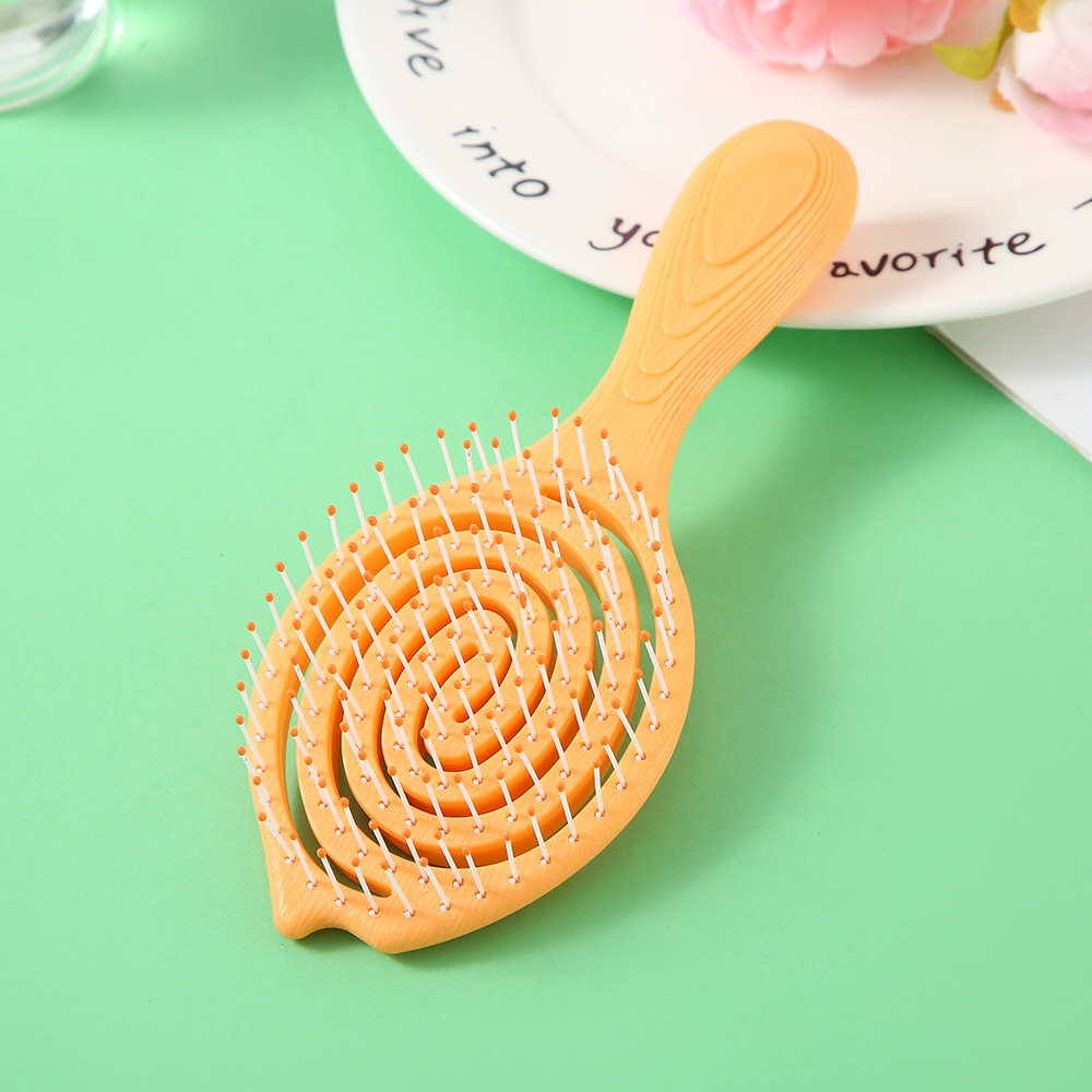 Wholesale of portable, practical and cute combs with a hollowed-out design on the head for massaging the scalp meridians Application Scenario