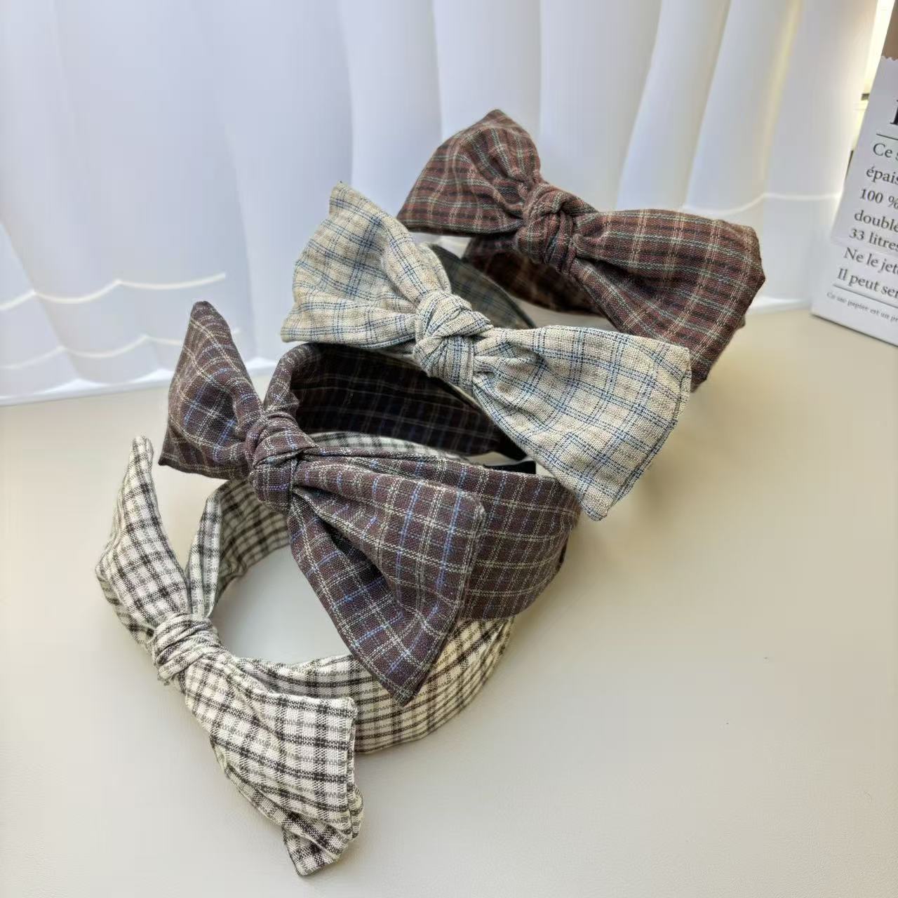 The new light luxury checkered rabbit ear headwear is a trendy and high-end headwear that goes well with all kinds of hair bands for women