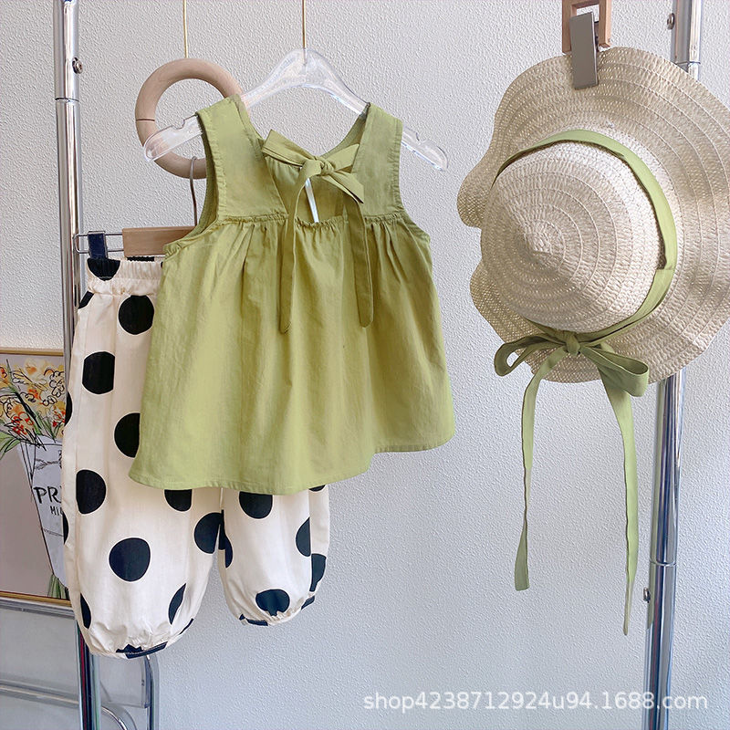 A two-piece Korean polka dot casual set for girls in summer 2023, featuring a sleeveless top and polka dot wide-leg pants details Picture