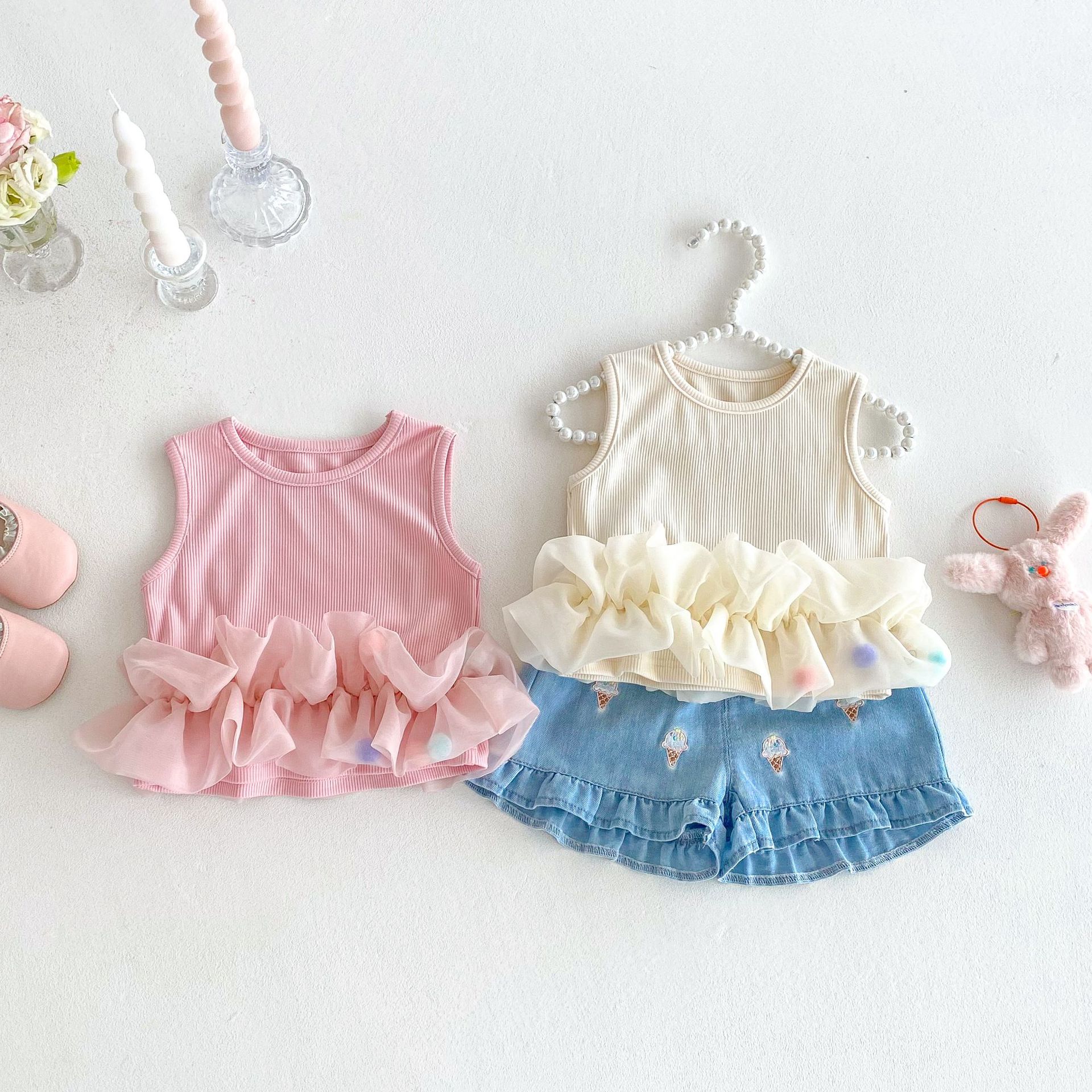The 2025 new style of tulle vest for summer girls is a stylish and sweet tulle patchwork vest paired with ice cream denim shorts full figure