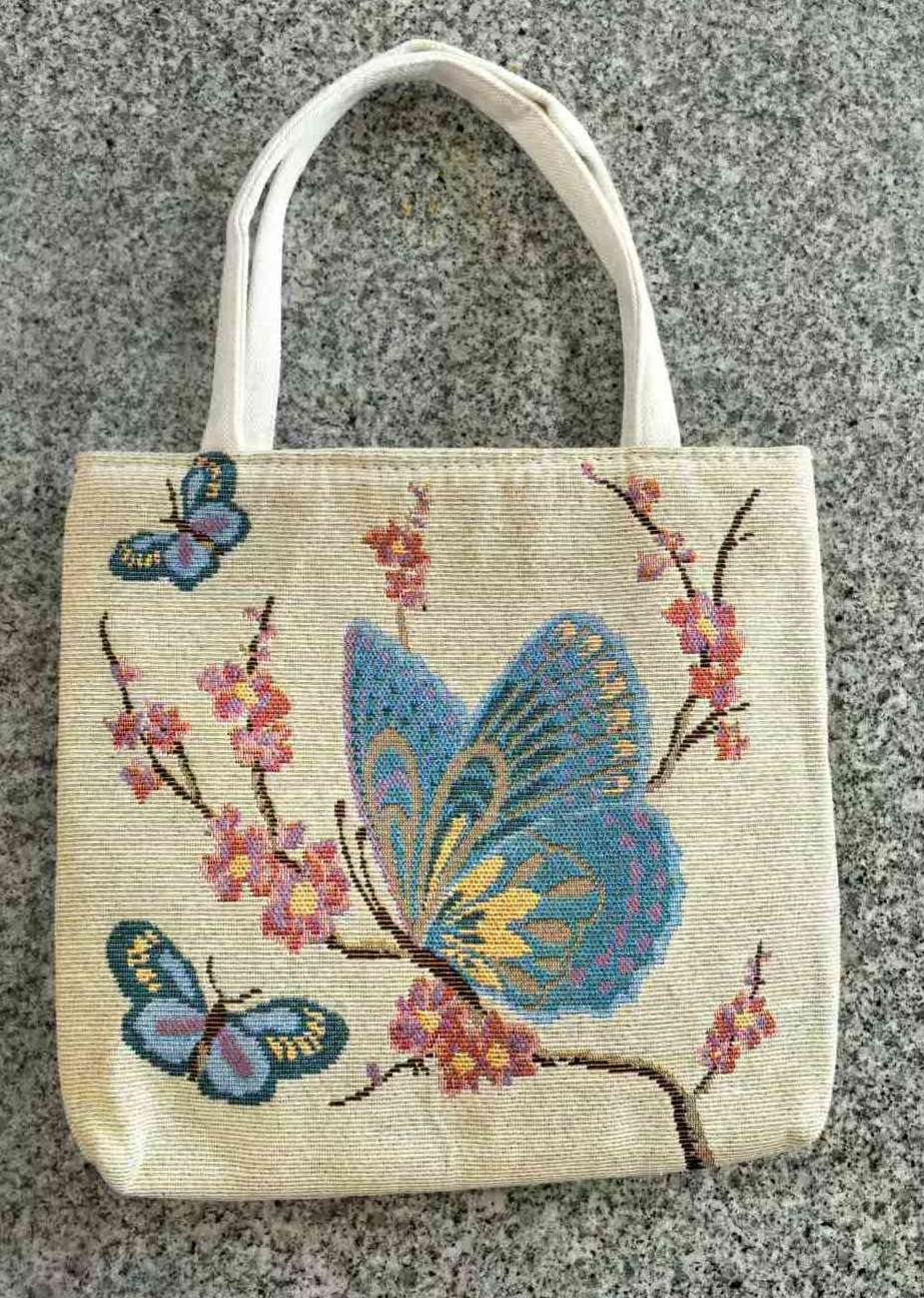 提花手提蝴蝶花型手提小包产品图