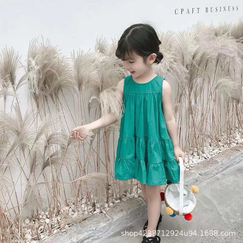 The new summer dress of the internet-famous girl in 2023 is a pure cotton solid color loose sleeveless dress with a Korean beach style and a stylish big swing details Picture