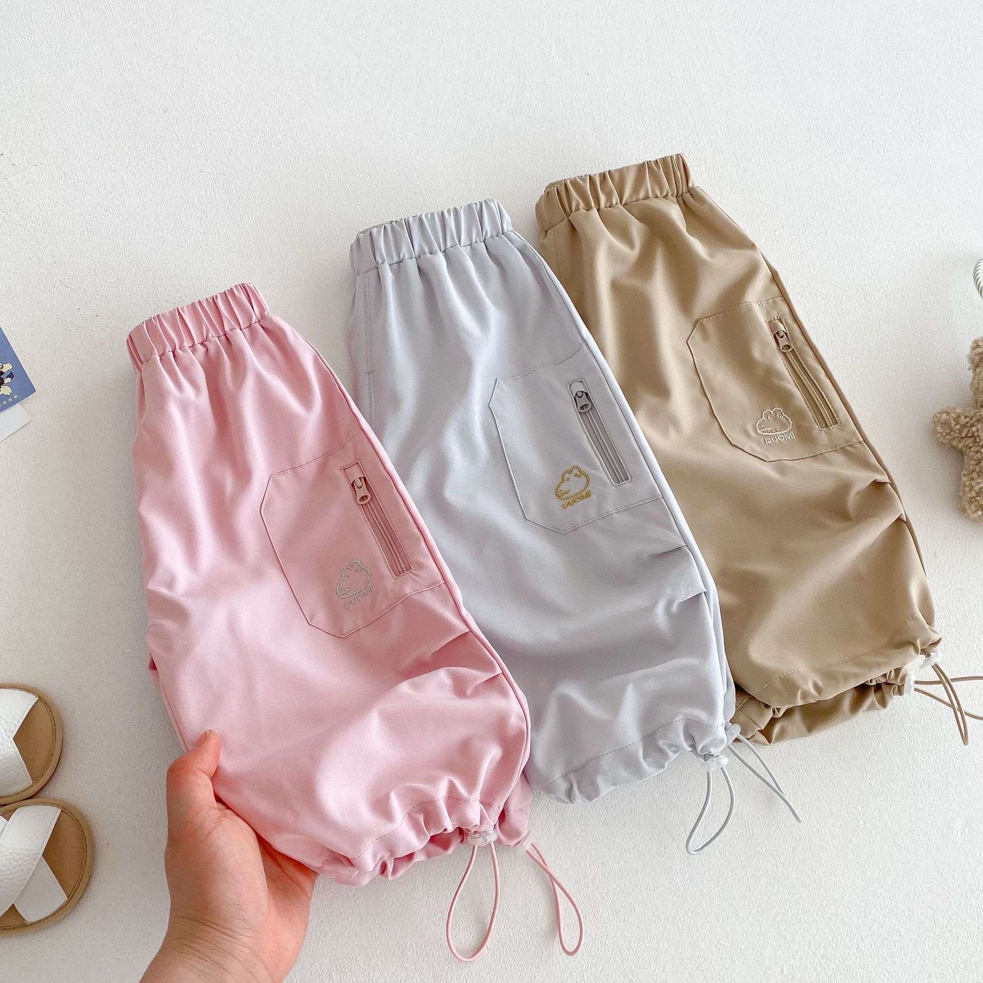 Children's cool workwear pants 2025 new summer solid color breathable casual pants for girls and Korean cartoon pants for boys details Picture