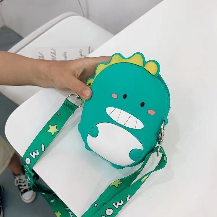 跨境现货 日系卡通萌恐龙硅胶包包 便携式斜跨单肩包 女童零钱包零钱包硅胶包白底实物图