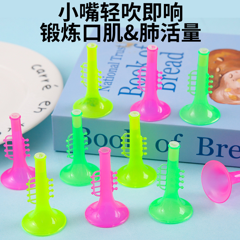 Wholesale of children's plastic transparent mini trumpet instruments, gashapon, fun eggs, street stalls, gifts, toys, and kindergarten gifts full figure
