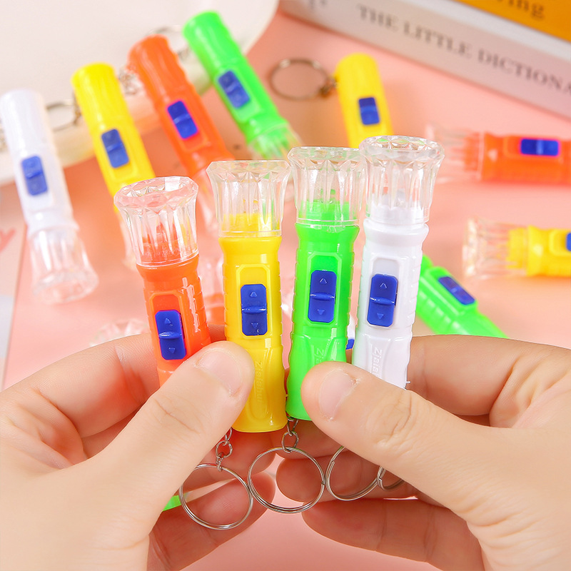 Mini electric lights, small flashlights, LED plastic small flashlights, colorful hand lights, illuminated children's street stall small toys Application Scenario