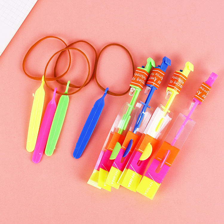 Wholesale of led light-up small flying arrows, flashing bamboo dragonflies, catapult flying rockets and children's light-up toys that are selling well at street stalls details Picture