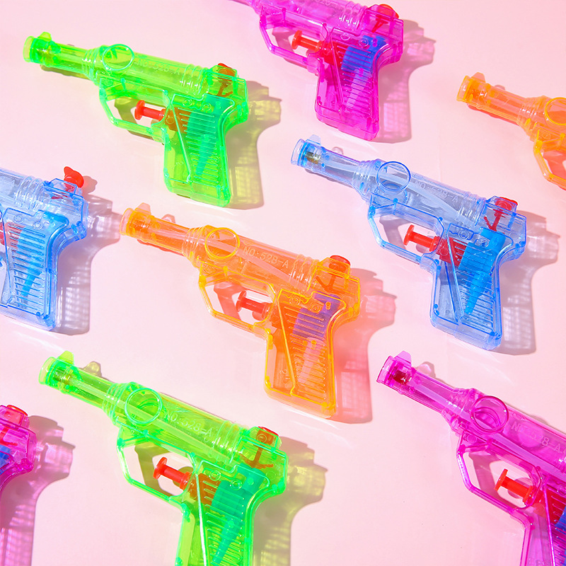 Mini candy-colored water guns, water play toys, beach water fights and children's gifts are selling well at street stalls in summer full figure