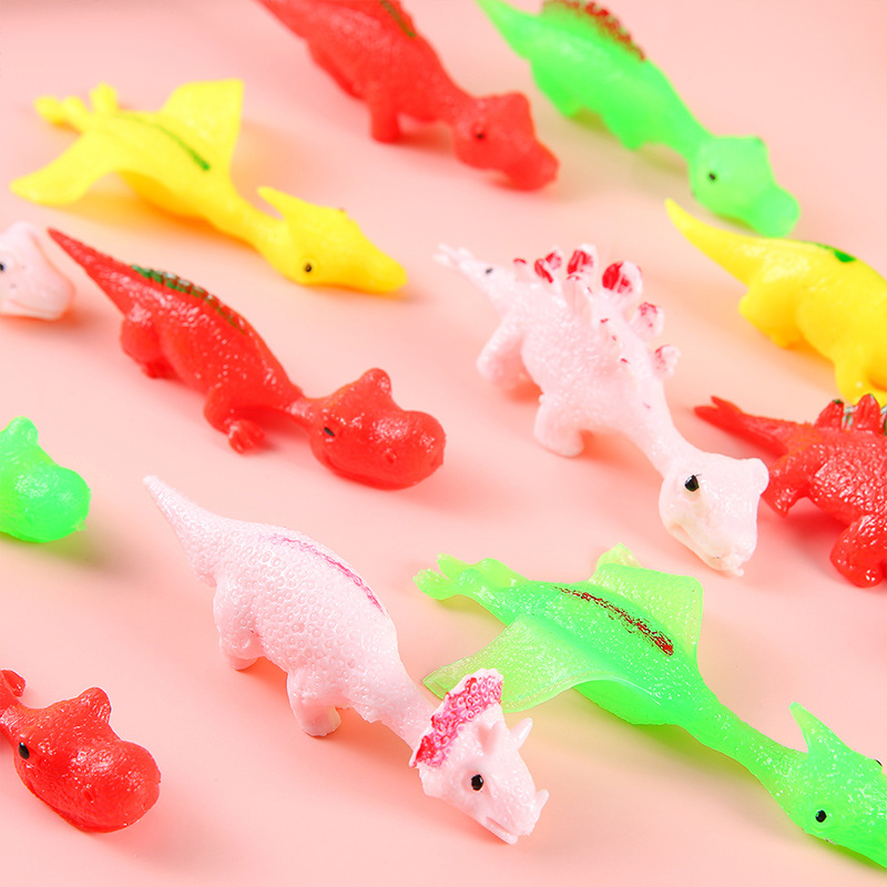 Wholesale of fun dinosaur catapulting toys, finger darts, little dinosaur stress-relieving soft rubber kindergarten gifts details Picture