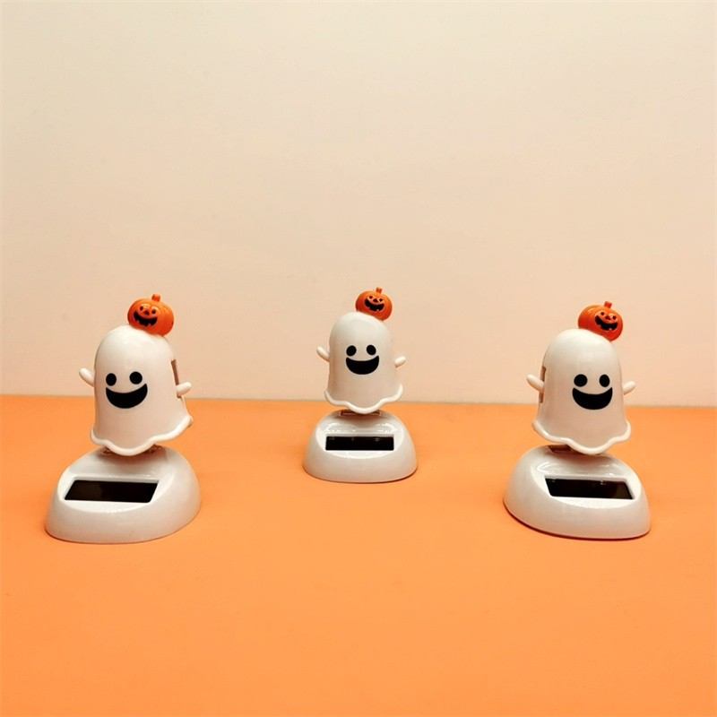 Halloween solar-powered creative swinging and shaking dolls, car ornaments, ghost cartoon, and funny car for the Ghost Festival