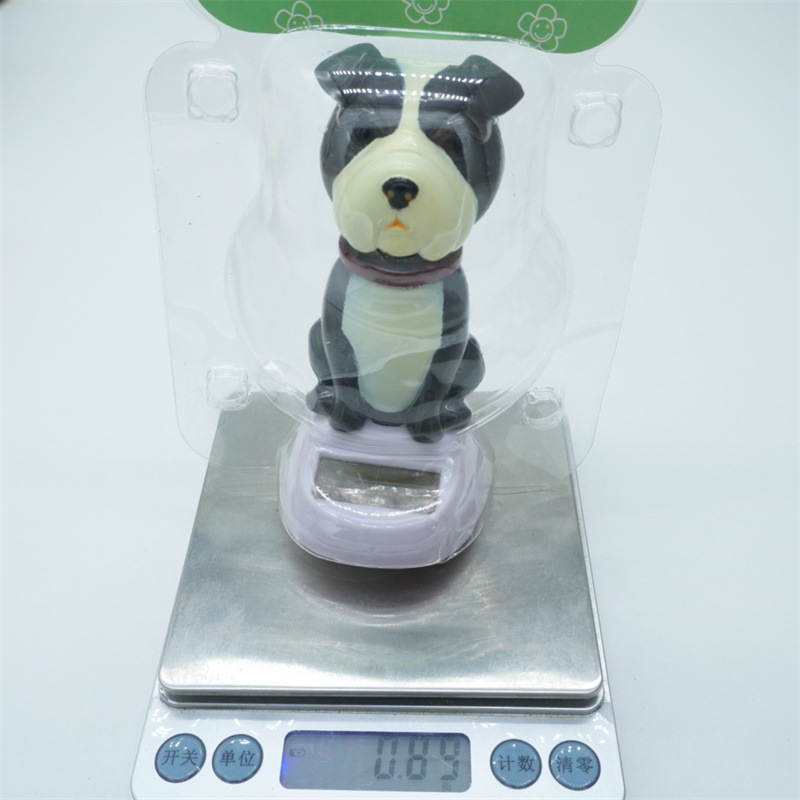 Car ornaments, resin interior decorations, solar car, shaking dog interior accessories, shaking and waving dolls