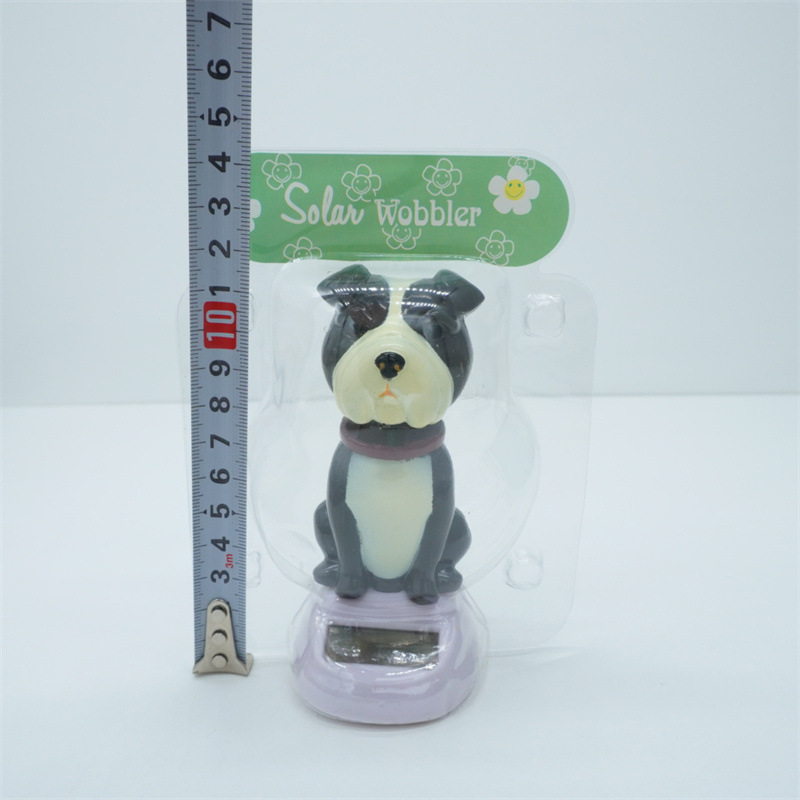 Car ornaments, resin interior decorations, solar car, shaking dog interior accessories, shaking and waving dolls