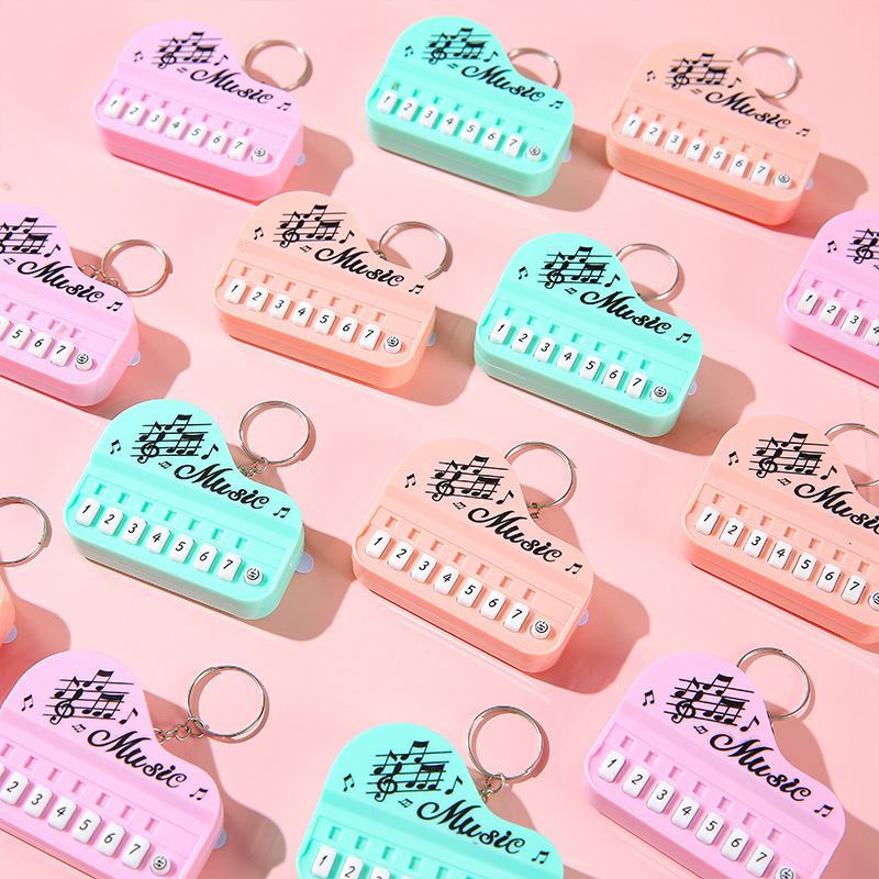 New creative portable children's electronic keyboard keychain pendant, luminous music mini toy, play 3D piano details Picture