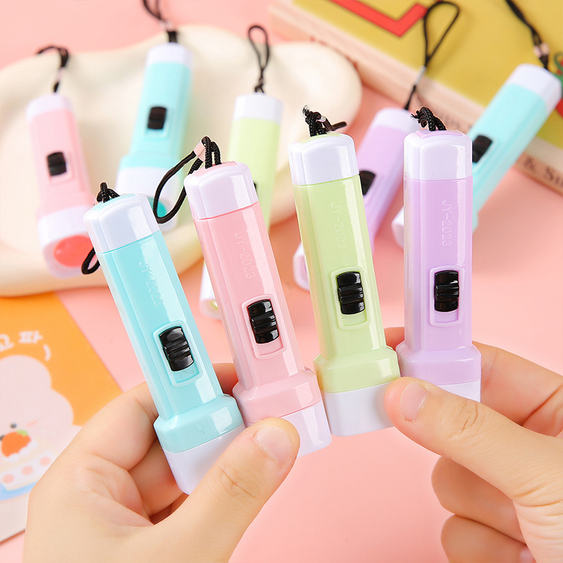 Macaron-colored small flashlights, powerful flashlights, lighting lamps, LED street stalls, practical toys, gifts, kindergarten prizes full figure
