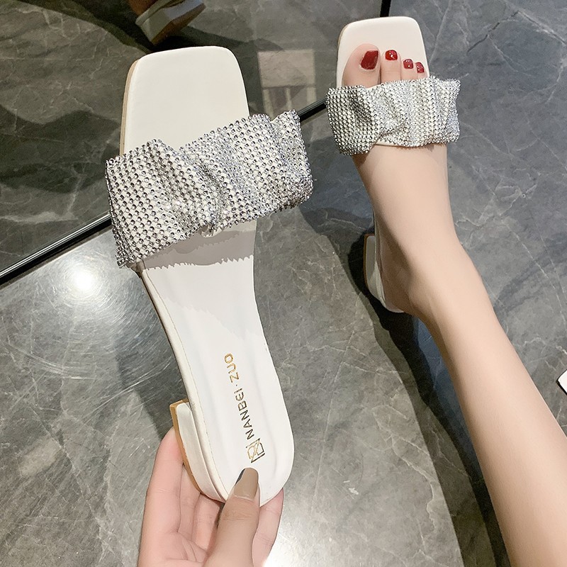 The new 2024 flip-flops are designed for women to wear outside with exposed toes and thick heels. They are a fashionable summer pair with rhinestones for women full figure