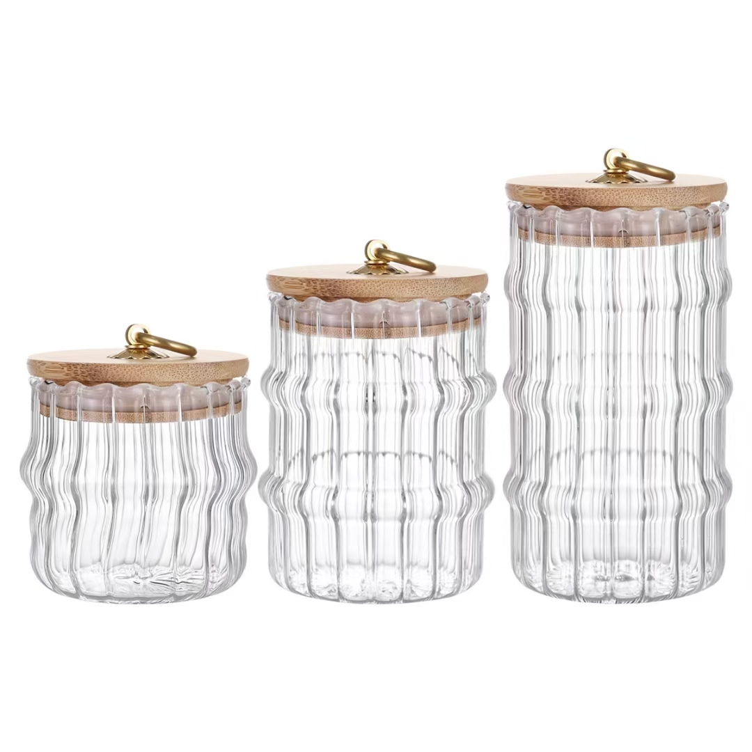 简约玻璃储物罐，木质盖配金属扣，三款大小渐变，透明设计便于收纳产品图