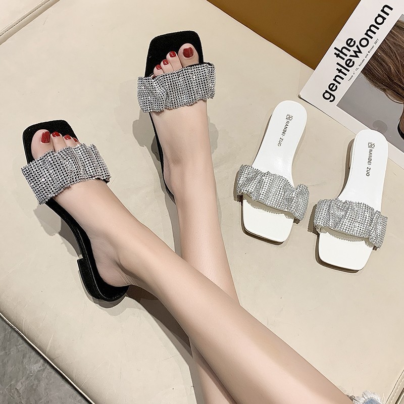 The new 2024 flip-flops are designed for women to wear outside with exposed toes and thick heels. They are a fashionable summer pair with rhinestones for women details Picture