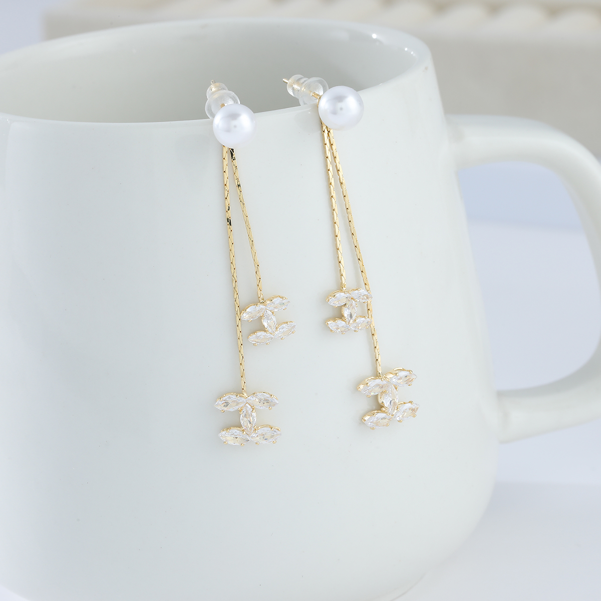 Xuhui brand exquisite and light luxury copper-plated with real gold and zircon inlaid 925 silver needle small Chanel style detachable long luxurious design fashionable stud earrings details Picture