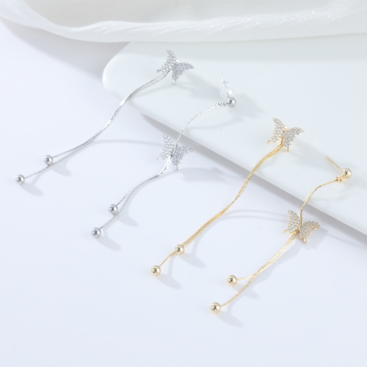 Xuhui brand exquisite and light luxury copper-plated with real gold and zircon inlaid 925 silver needle detachable butterfly long design super fairy luxury design fashionable stud earrings Application Scenario