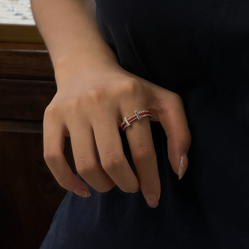 The H fashion layered ring features a simple yet eye-catching combination of red and white gold, highlighting individual charm