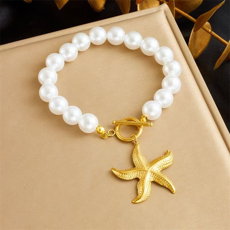 French retro design sense pearl chain, gilded OT clasp, stainless steel scallop and starfish pendant bracelet necklace set