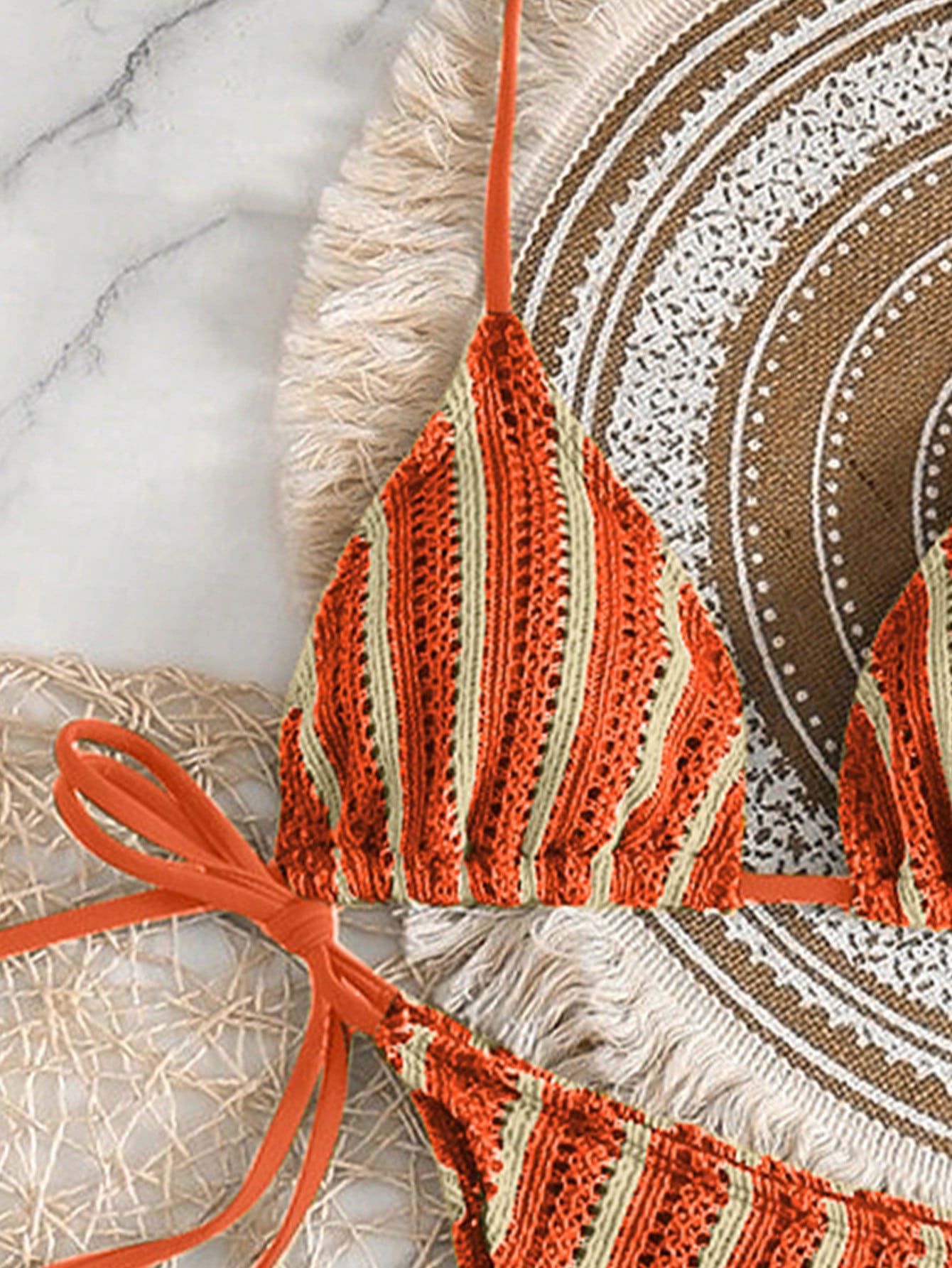 Styling the bikini with boho accessories: hat, jewelry, and bag