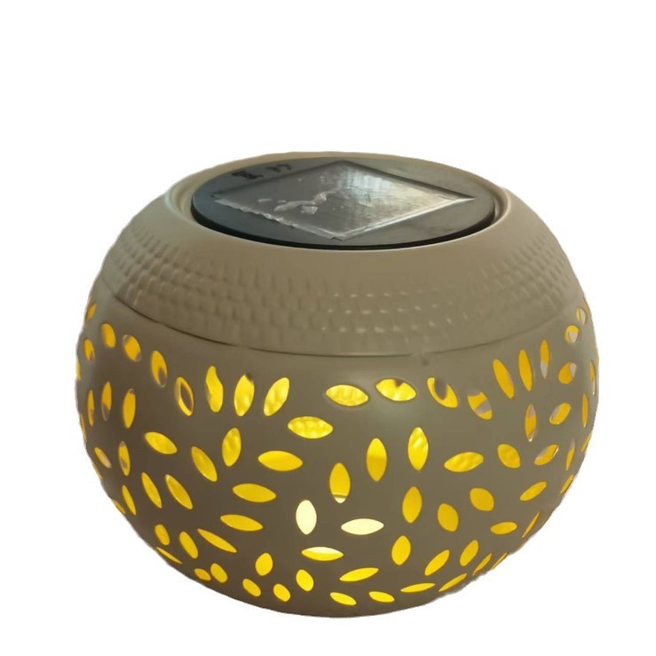 Cross-border outdoor ironwork solar lamps, imitation ceramic jars, hollowed-out lawn lamps, courtyard landscape lanterns, home aroma lamps Item Picture