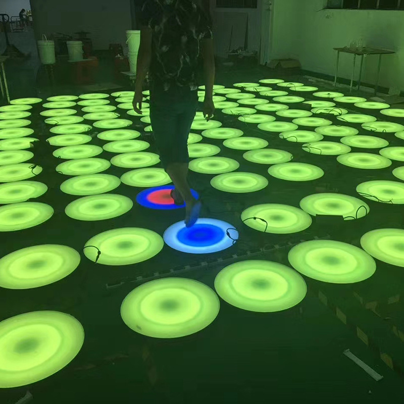 The new 500mm diameter LED circular floor tile light features a foot-sensing seven-color glow and a music color run Application Scenario
