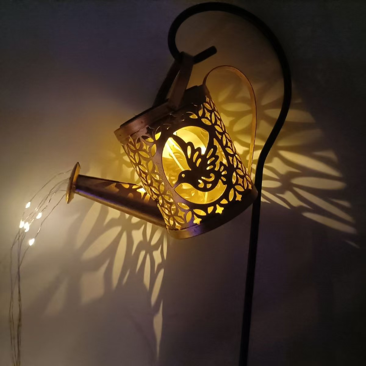 Amazon solar water bottle light, ironwork flowing water shower light, courtyard ground insert light, outdoor garden landscape decoration details Picture