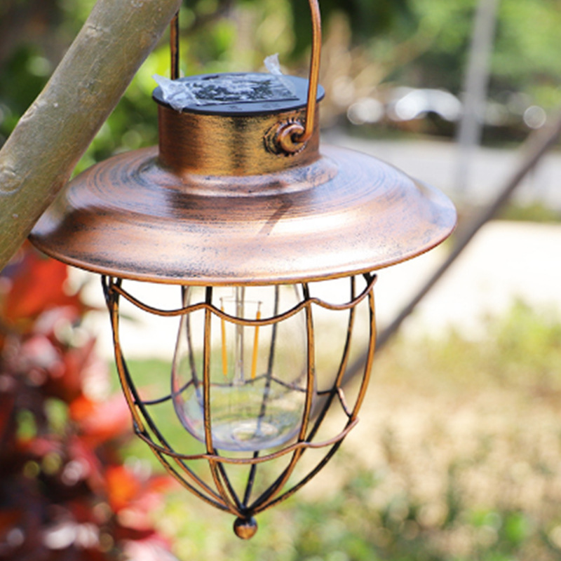 Cross-border solar ironwork hanging lamps, hollowed-out tungsten filament lanterns, retro hand-held lamps, outdoor garden lamps, lawn decorative lamps Application Scenario