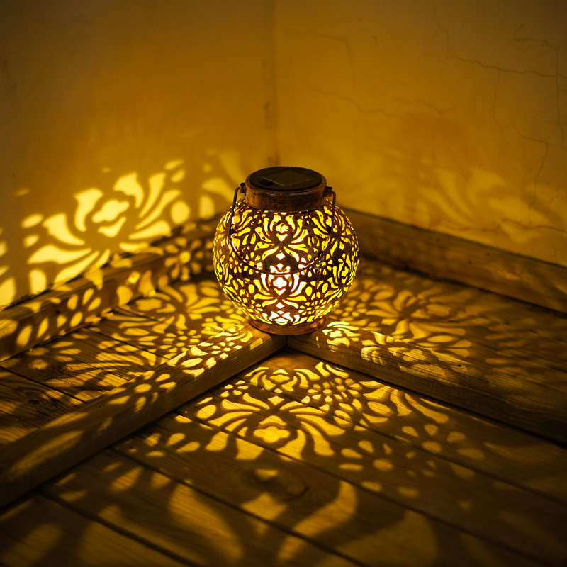 Solar-powered iron lanterns, hollowed-out lamps, outdoor waterproof garden lamps, decorative landscape garden lawn lamps, ornaments, hanging lamps details Picture