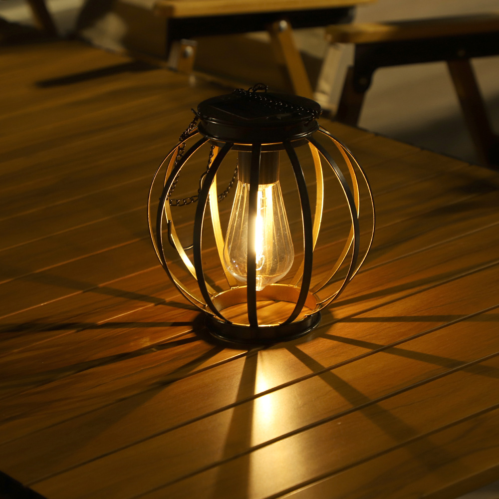 Cross-border new solar outdoor lanterns, terrace gardens, small doorways, iron railings, round flat iron pendant lamps and ornaments details Picture