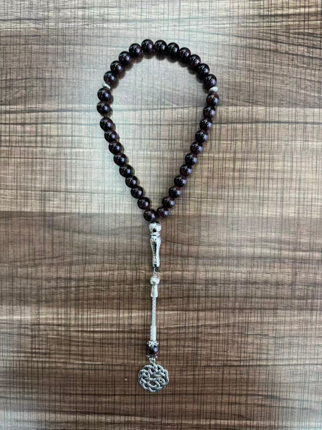 A new 33-piece hand-held prayer multi-color glass prayer bead from the Middle East Specification drawing