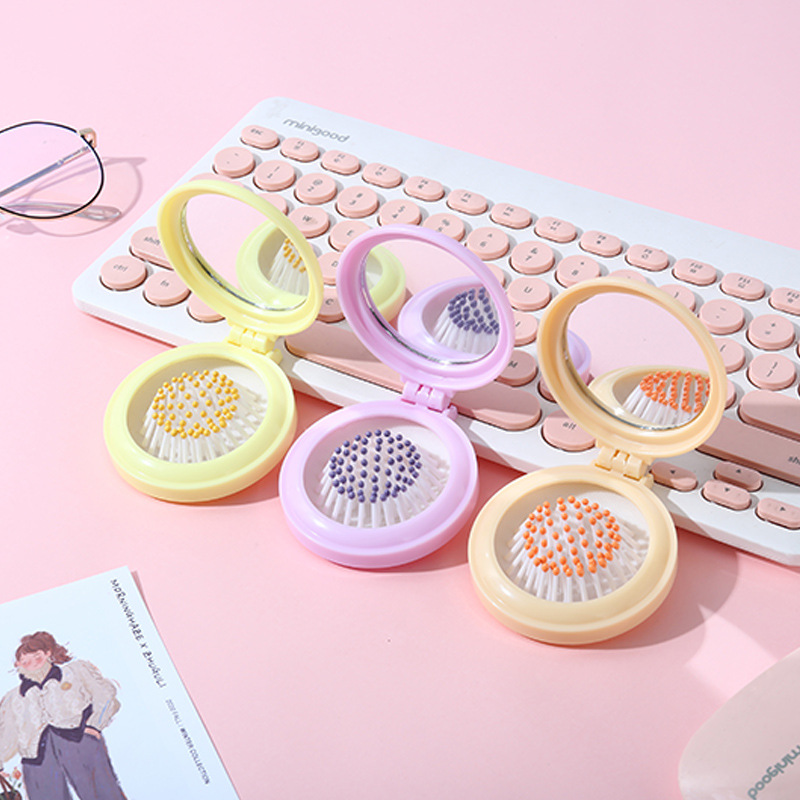Customized and wholesale of air cushion macaron dual-purpose round mirror portable hair care cute girl comb portable mirror comb details Picture