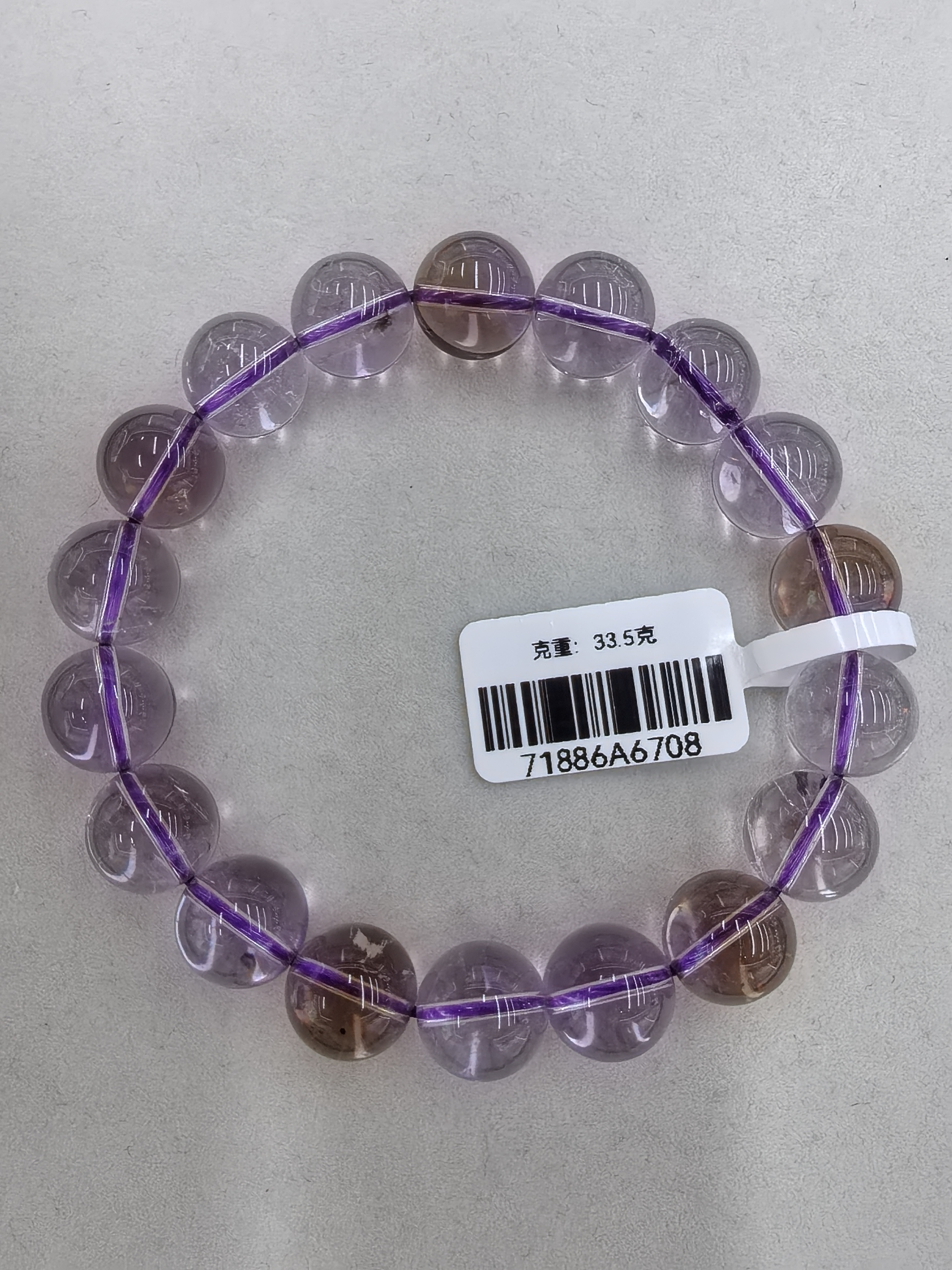 紫黄晶：双色宝石.鸢尾紫水晶“是暮色紫霞与鎏金朝阳的私语，是腕间流转的璀璨诗行，每一眼都让心跳漏拍～”
产品图