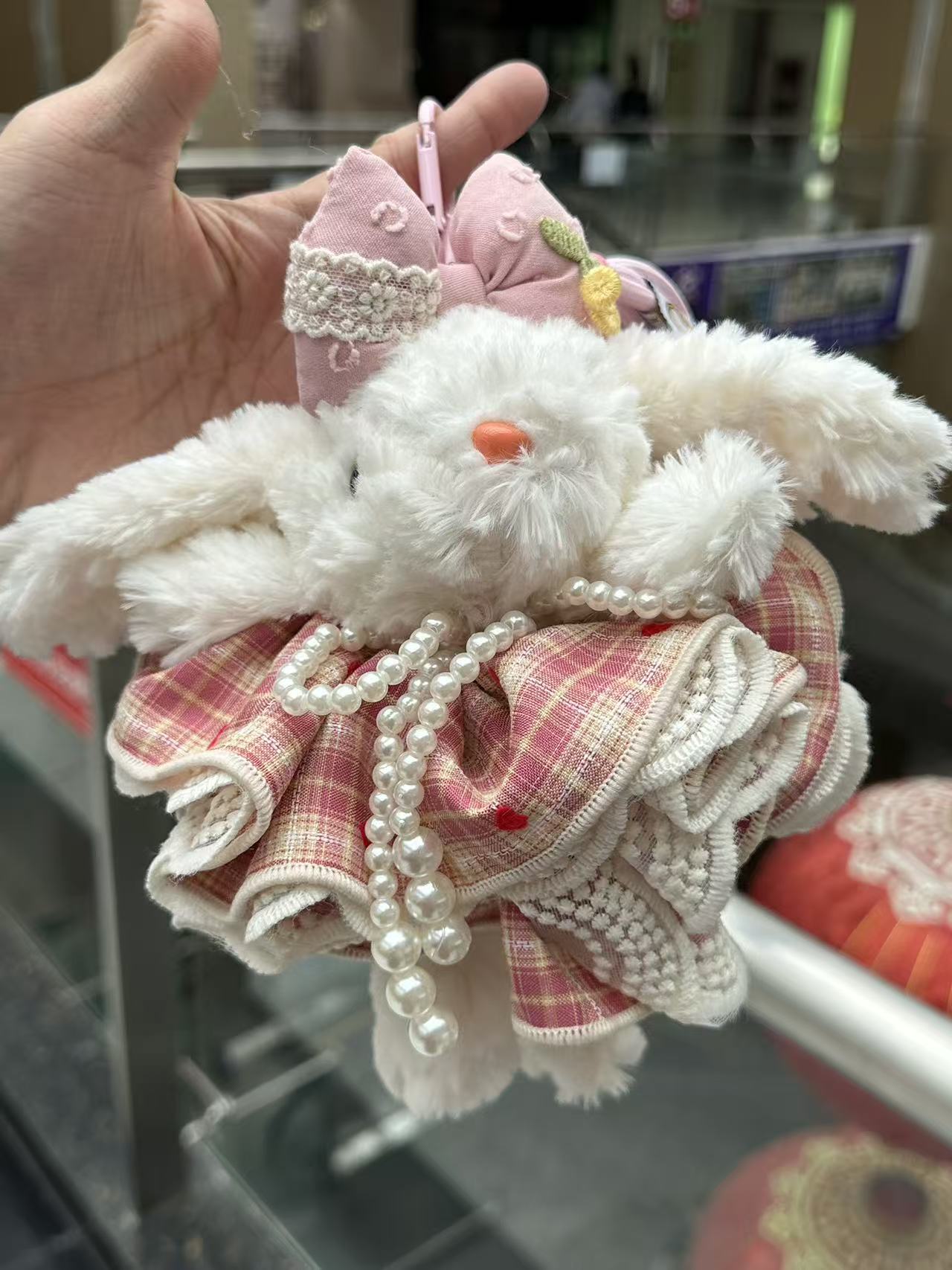 A 6-inch creative and trendy toy doll pendant in a red checkered dress style with droopy ears A 6-inch creative and trendy toy doll pendant in a red checkered dress style with droopy ears