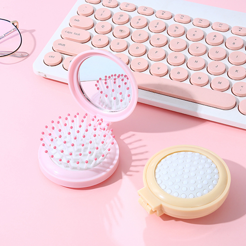 Customized and wholesale of air cushion macaron dual-purpose round mirror portable hair care cute girl comb portable mirror comb Specification image