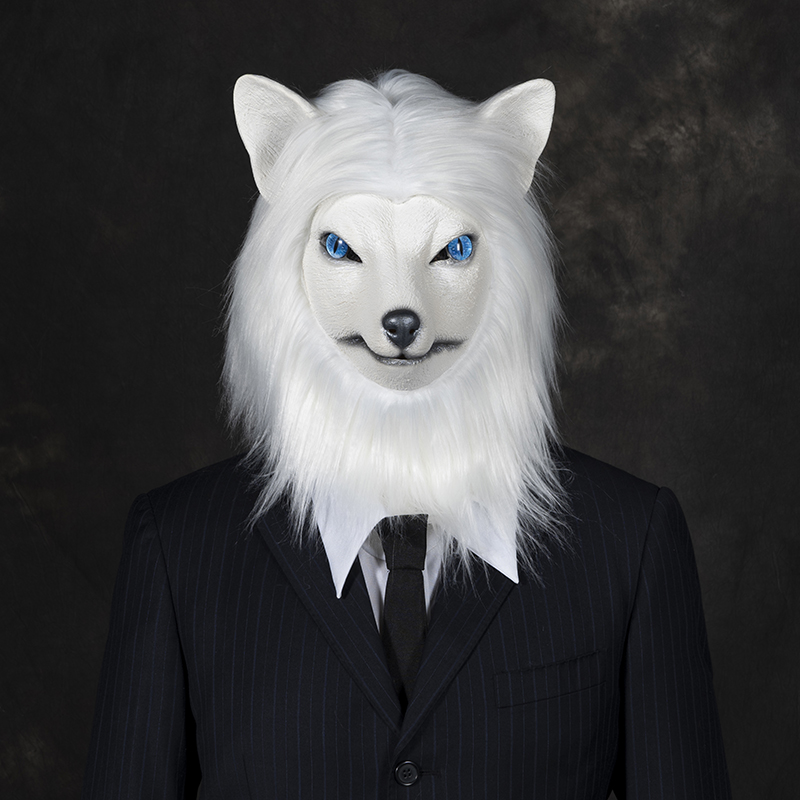 The man wearing a white fox mask in a suit exudes an air of mystery and has sparked heated discussions.