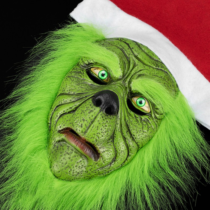 The green monster under the Christmas monster hat is strange and funny, with a hint of horror in the festive atmosphere Specification image