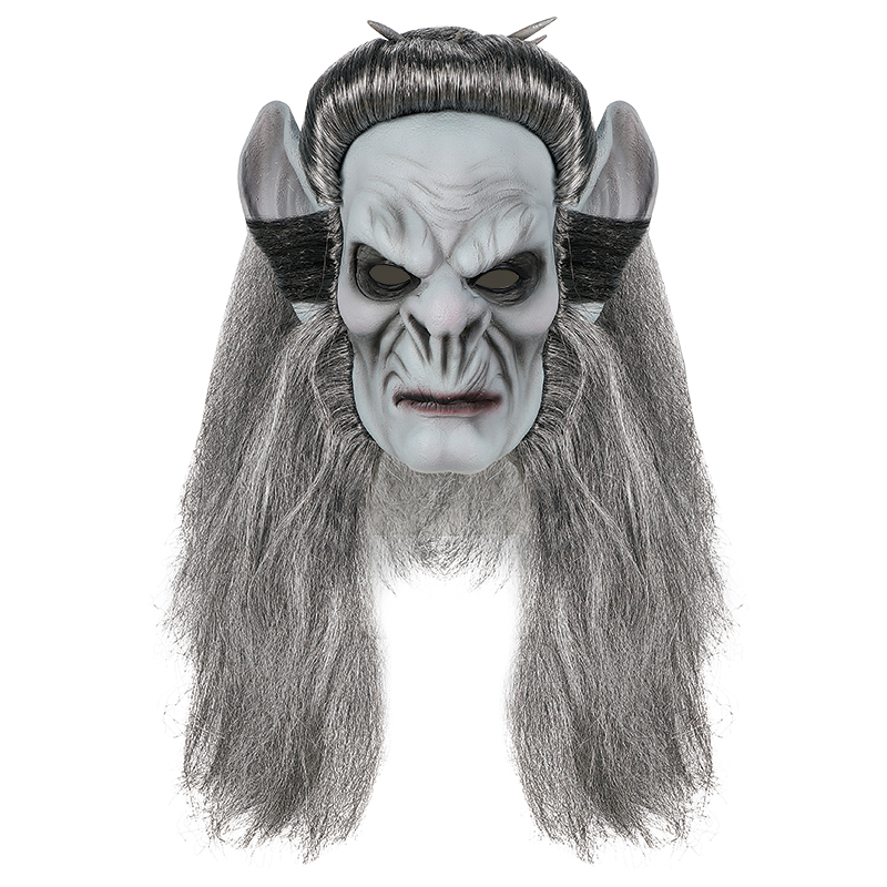 The terrifying demon mask with grey hair, pointed ears and a hideous face is a popular Halloween costume details Picture