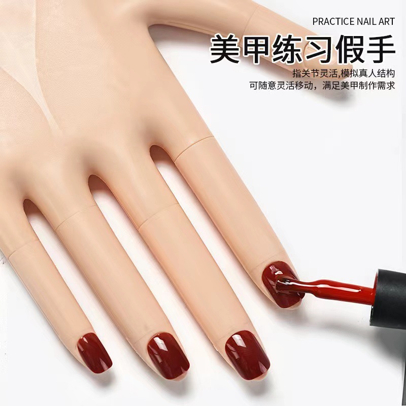 The new detachable practice prosthetic hand for nail art is made of silicone with movable palm and fingers and nail plates details Picture