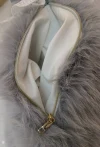 The luxurious grey and white fur bag with golden zipper details exudes a sense of high-end fashion. Super soft details Picture