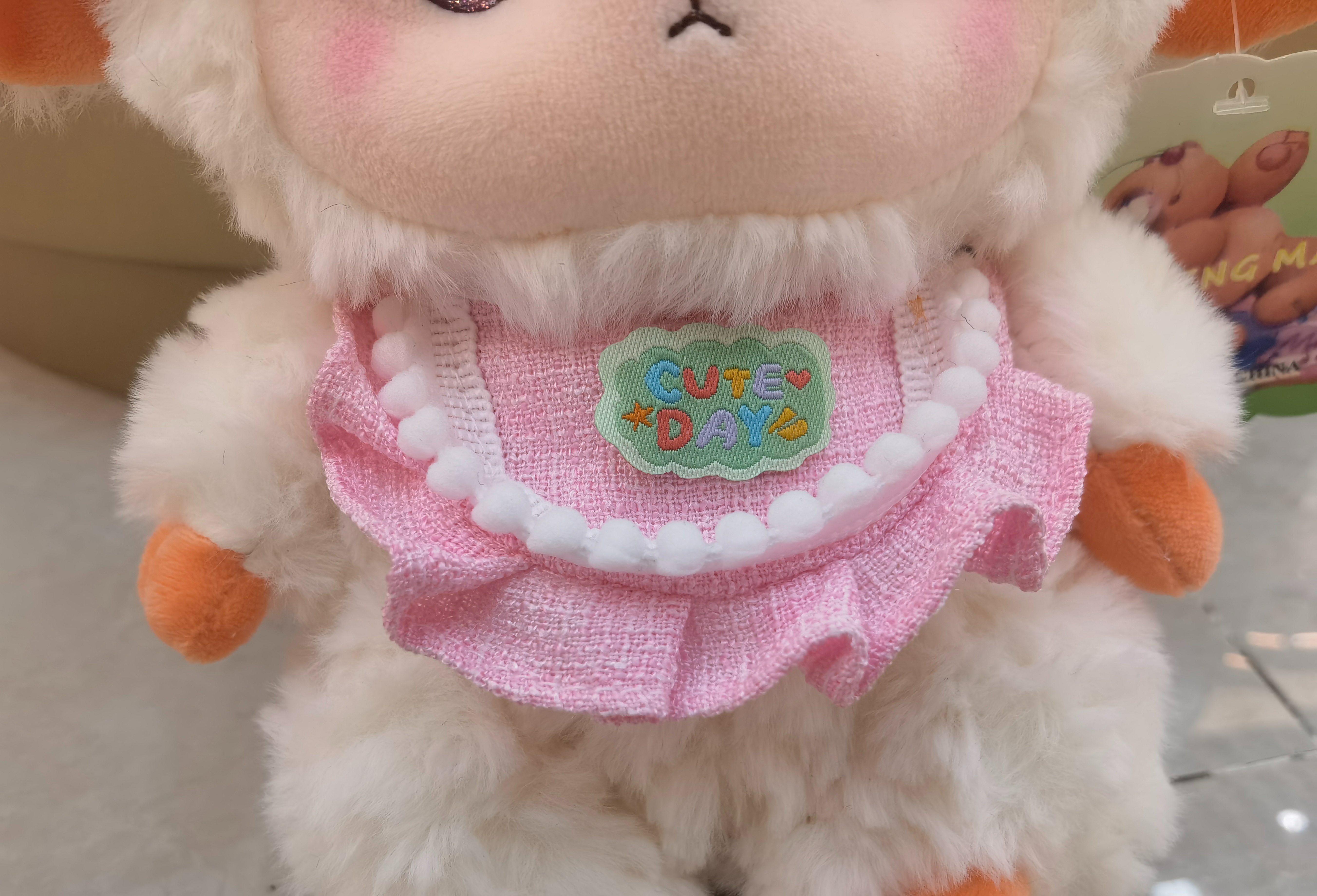 A 23CM cute little lamb doll in a pink dress is super adorable and will melt everyone's heart! Super soft Specification image