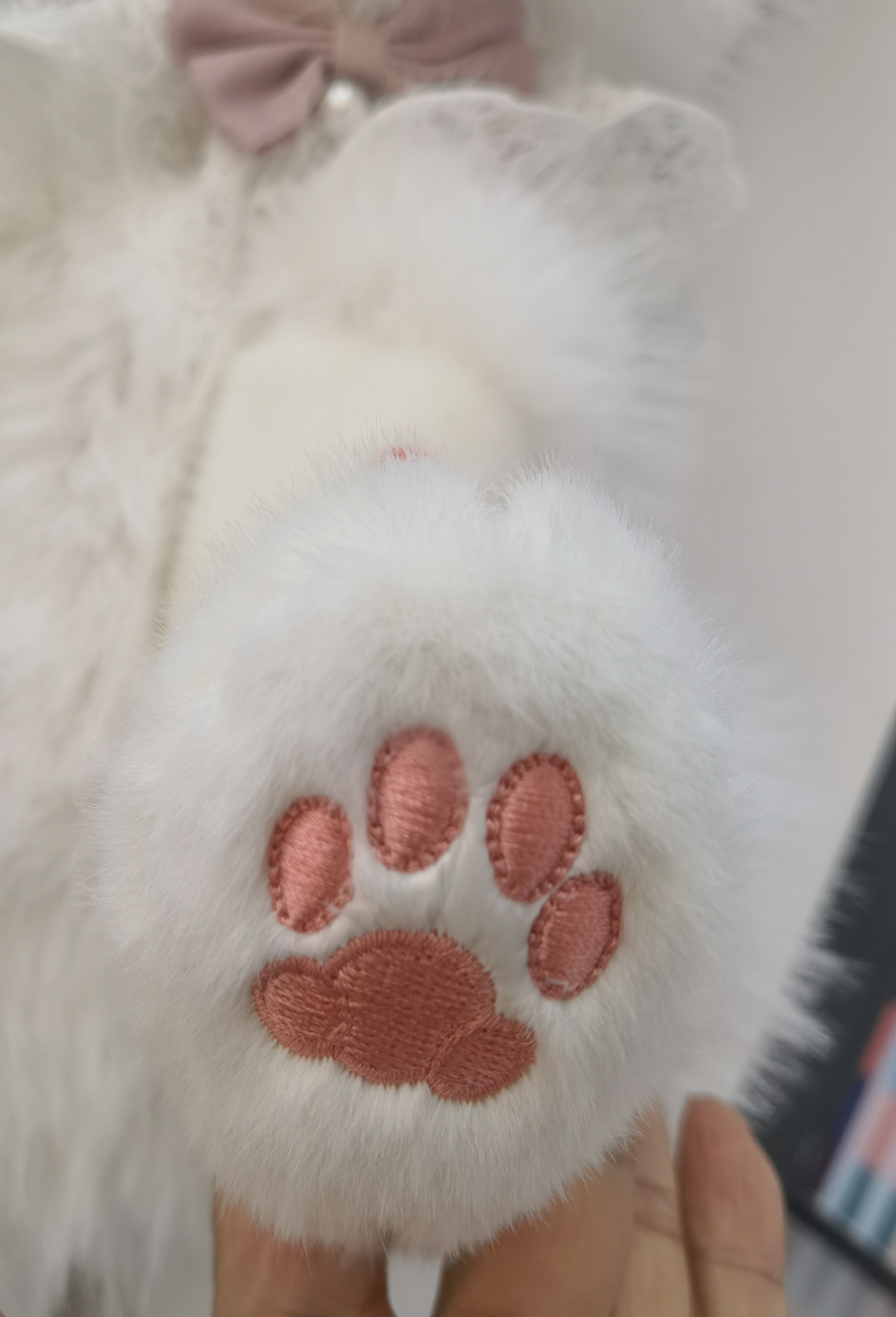 The luxurious grey and white fur bag with golden zipper details exudes a sense of high-end fashion. Super soft Specification image